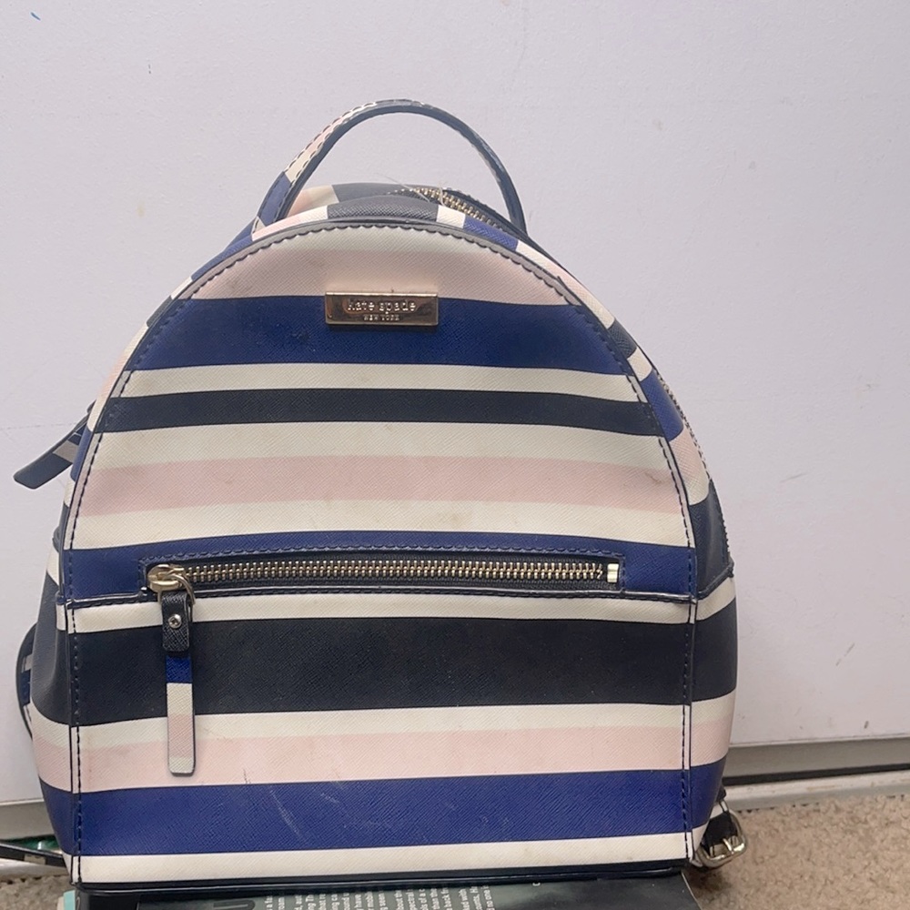 Kate spade blue, black pink white stripe backpack.